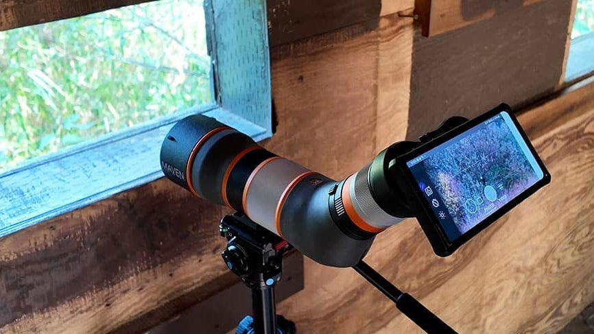 Digiscoping birds (bird watching) from a wildlife blind.