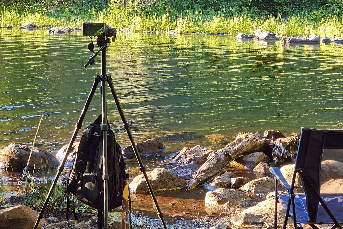 tripod stabilized by hanging a backpack for weight.