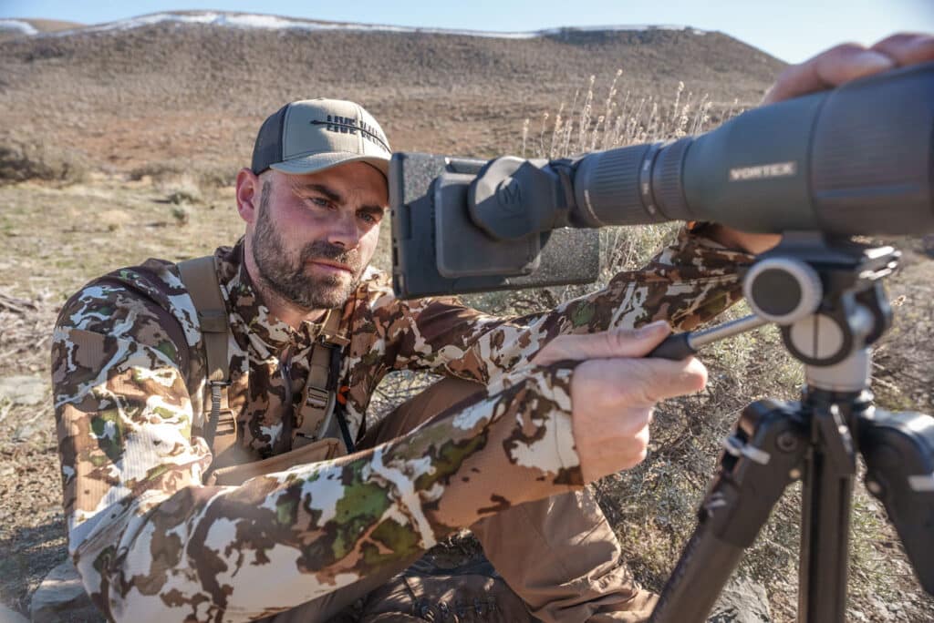 Remi Warren hunting using magview s1 digiscoping adaptor.