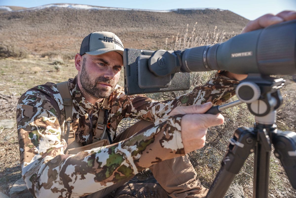 Remi Warren hunting using magview s1 digiscoping adaptor.