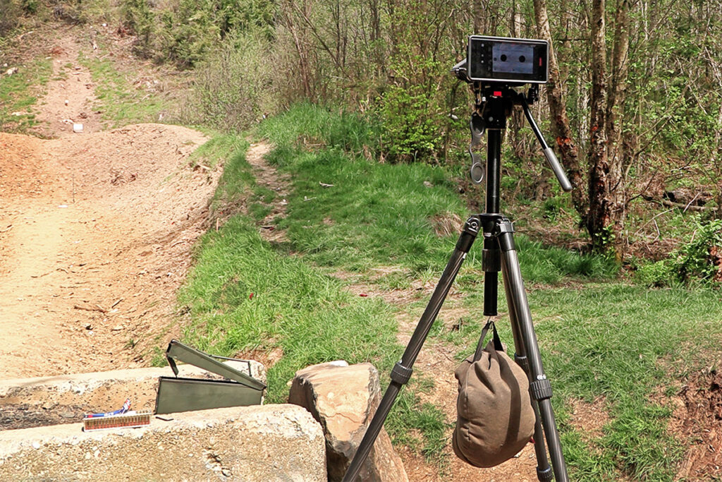 shooting bag hanging from tripod to stabilize a camera.